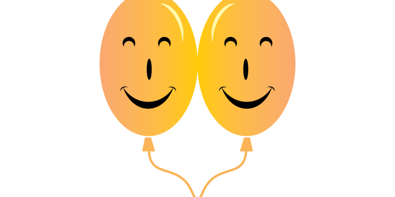 Background of smiling balloons – free vector