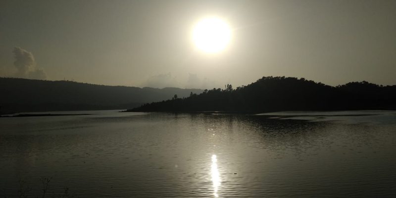 Sun shines over river water – free photo