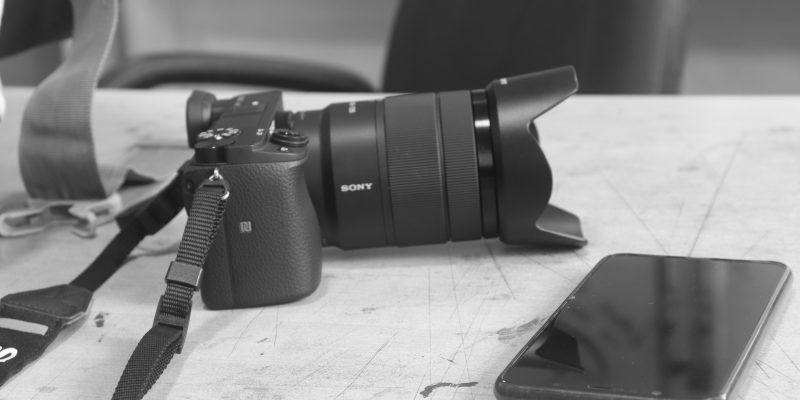 Camera with smartphone close-up background  image – free photo