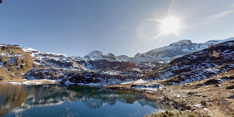 Scenic view of lake by snowcapped mountains with sky – free photo