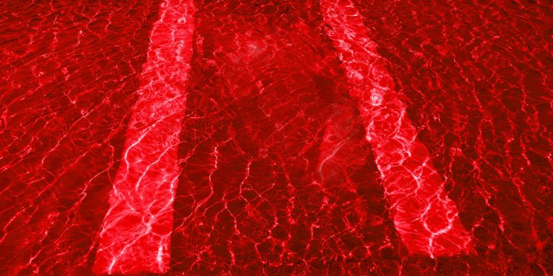 Abstract defocused red glittering background image and pictures – Stock Photos